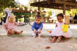 Preschool Children Playing In Sandbox - After School Program, income generation for schools strategies