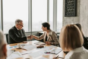 Buy an Existing Preschool: Business People Shaking Hands at a Conference Table