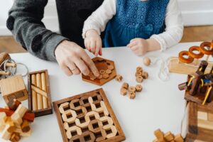 Teacher and Child Playing with Blocks, preschool value