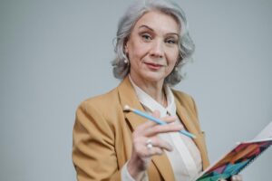 Teacher Holding a Pen, preschool tuition